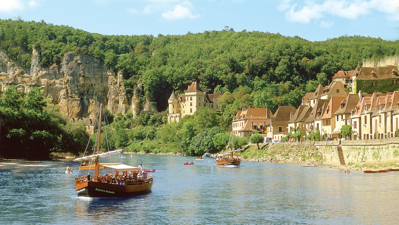 Two Gabare Boats passing by Dordogne France